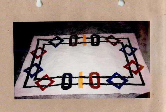 Photograph of geometric wool hooked rug